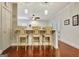 Charming bar area with seating for three and a view into adjacent living spaces at 1801 Ridgefield Dr, Peachtree City, GA 30269