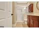 Bathroom featuring tiled floors, walk in shower, and dark wood vanity at 1801 Ridgefield Dr, Peachtree City, GA 30269