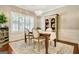 Well-lit dining room featuring stylish chandelier, modern furnishings, and detailed trim work at 1801 Ridgefield Dr, Peachtree City, GA 30269