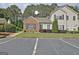 Charming townhome featuring brick accents, manicured landscaping and convenient parking at 1801 Ridgefield Dr, Peachtree City, GA 30269