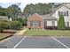 Charming condo building featuring a well-manicured lawn and convenient parking at 1801 Ridgefield Dr, Peachtree City, GA 30269