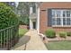 Inviting entrance with lush greenery and a well-maintained walkway to the front door at 1801 Ridgefield Dr, Peachtree City, GA 30269