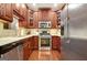Well-equipped kitchen with stainless steel appliances, granite countertops, and ample cabinet space at 1801 Ridgefield Dr, Peachtree City, GA 30269