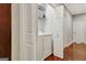 Laundry room with stackable washer and dryer behind a closet door at 1801 Ridgefield Dr, Peachtree City, GA 30269