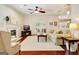 Spacious living room with a fireplace, large windows, and hardwood floors at 1801 Ridgefield Dr, Peachtree City, GA 30269