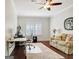Office space featuring wood floors, a ceiling fan, desk and a comfortable sofa at 1801 Ridgefield Dr, Peachtree City, GA 30269