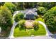 Overhead view of a beautiful landscaped home with a circular driveway at 115 Champion Dr, Carrollton, GA 30116