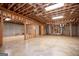 Unfinished basement with exposed wood ceiling beams and duct work, ready to be transformed at 115 Champion Dr, Carrollton, GA 30116