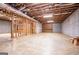 Spacious unfinished basement featuring concrete walls and exposed wood framing, ideal for customization at 115 Champion Dr, Carrollton, GA 30116