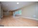 Spacious basement with natural light, recessed lighting, light wood floors, and neutral colored walls at 115 Champion Dr, Carrollton, GA 30116