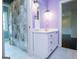Bathroom featuring a vanity, shower with curtain and light purple walls at 115 Champion Dr, Carrollton, GA 30116