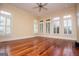 Bedroom featuring white walls, hardwood floors and plenty of natural light at 115 Champion Dr, Carrollton, GA 30116