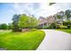 Two-story home with a large, well-manicured front lawn at 115 Champion Dr, Carrollton, GA 30116