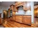 Gourmet kitchen featuring stainless steel appliances, including double ovens and a gas cooktop, set in custom wood cabinetry at 115 Champion Dr, Carrollton, GA 30116