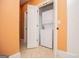 Laundry room featuring a stacked washer and dryer in a bright and clean space at 115 Champion Dr, Carrollton, GA 30116