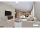 Spacious living room with seating and television at 115 Champion Dr, Carrollton, GA 30116