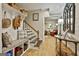 Inviting basement entryway with custom bench seating and bright, natural light, leading to the main living area at 100 Rosemont, Peachtree City, GA 30269