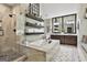 Luxurious bathroom with a glass-enclosed shower, soaking tub, double vanity, and floating shelves at 100 Rosemont, Peachtree City, GA 30269