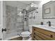 Elegant bathroom featuring a glass shower with designer tile, shiplap wall, and a custom vanity at 100 Rosemont, Peachtree City, GA 30269