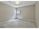 This bedroom features carpeted floors and natural lighting from a single window at 100 Rosemont, Peachtree City, GA 30269