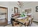 Inviting dining room with a wooden table, chandelier, and stylish decor at 100 Rosemont, Peachtree City, GA 30269