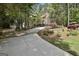 Charming exterior with long driveway and beautiful landscaping at 100 Rosemont, Peachtree City, GA 30269