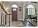 Welcoming foyer featuring hardwood floors, arched windows, and view into the dining room at 100 Rosemont, Peachtree City, GA 30269