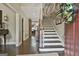 Entryway featuring hardwood floors, staircase, and view into the living room at 100 Rosemont, Peachtree City, GA 30269