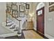 Foyer with dark wood floors, staircase, and decor at 100 Rosemont, Peachtree City, GA 30269