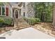 Inviting front steps leading up to the door, featuring lush landscaping and stone path at 100 Rosemont, Peachtree City, GA 30269