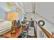 Hallway with a map of the world, desk with a lamp, and a view of the stairs at 100 Rosemont, Peachtree City, GA 30269