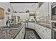 Kitchen featuring granite countertops, stainless appliances, and a center island cooktop at 100 Rosemont, Peachtree City, GA 30269