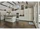 Spacious kitchen with a large island, stainless steel appliances, and custom cabinets for a luxurious cooking experience at 100 Rosemont, Peachtree City, GA 30269