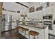 Bright kitchen featuring an island with a granite countertop and seating, with stainless steel appliances at 100 Rosemont, Peachtree City, GA 30269