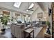 Bright living room with hardwood floors, skylights, and comfortable seating arrangements at 100 Rosemont, Peachtree City, GA 30269