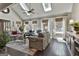 Light-filled living room featuring hardwood floors, skylights, and comfortable seating at 100 Rosemont, Peachtree City, GA 30269