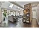 Open-concept living room with hardwood floors, skylights, and stylish furniture at 100 Rosemont, Peachtree City, GA 30269