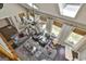Open-concept living room boasts natural light, high ceilings, and stylish furniture, perfect for relaxation and entertaining at 100 Rosemont, Peachtree City, GA 30269