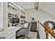 This office features custom built-ins, a desk, an office chair, and natural lighting at 100 Rosemont, Peachtree City, GA 30269