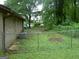 Backyard view of a brick home with a chain link fence at 981 E Atlanta Rd, Stockbridge, GA 30281