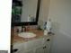 Bathroom vanity with a marble countertop and a white sink at 981 E Atlanta Rd, Stockbridge, GA 30281