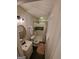 Bathroom features updated lighting, vanity, and a tiled shower with glass door at 981 E Atlanta Rd, Stockbridge, GA 30281