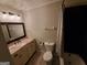 Bathroom features a decorative mirror, granite countertop, and a shower and tub combination at 981 E Atlanta Rd, Stockbridge, GA 30281