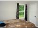 Bright bedroom featuring a window with natural light and views of the outdoors at 981 E Atlanta Rd, Stockbridge, GA 30281