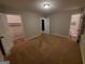 Neutral bedroom with plush carpeting and ensuite bathroom and large closet access at 981 E Atlanta Rd, Stockbridge, GA 30281