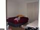Bedroom featuring two beds and a window with a curtain at 981 E Atlanta Rd, Stockbridge, GA 30281