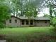Charming brick home with a front porch and green lawn at 981 E Atlanta Rd, Stockbridge, GA 30281