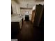 Well-lit kitchen features white cabinets, subway tile backsplash, and a black range oven at 981 E Atlanta Rd, Stockbridge, GA 30281