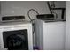 Bright laundry area features a white Samsung washer and dryer set with modern details at 981 E Atlanta Rd, Stockbridge, GA 30281