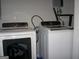 Laundry room features a white washing machine and dryer set at 981 E Atlanta Rd, Stockbridge, GA 30281